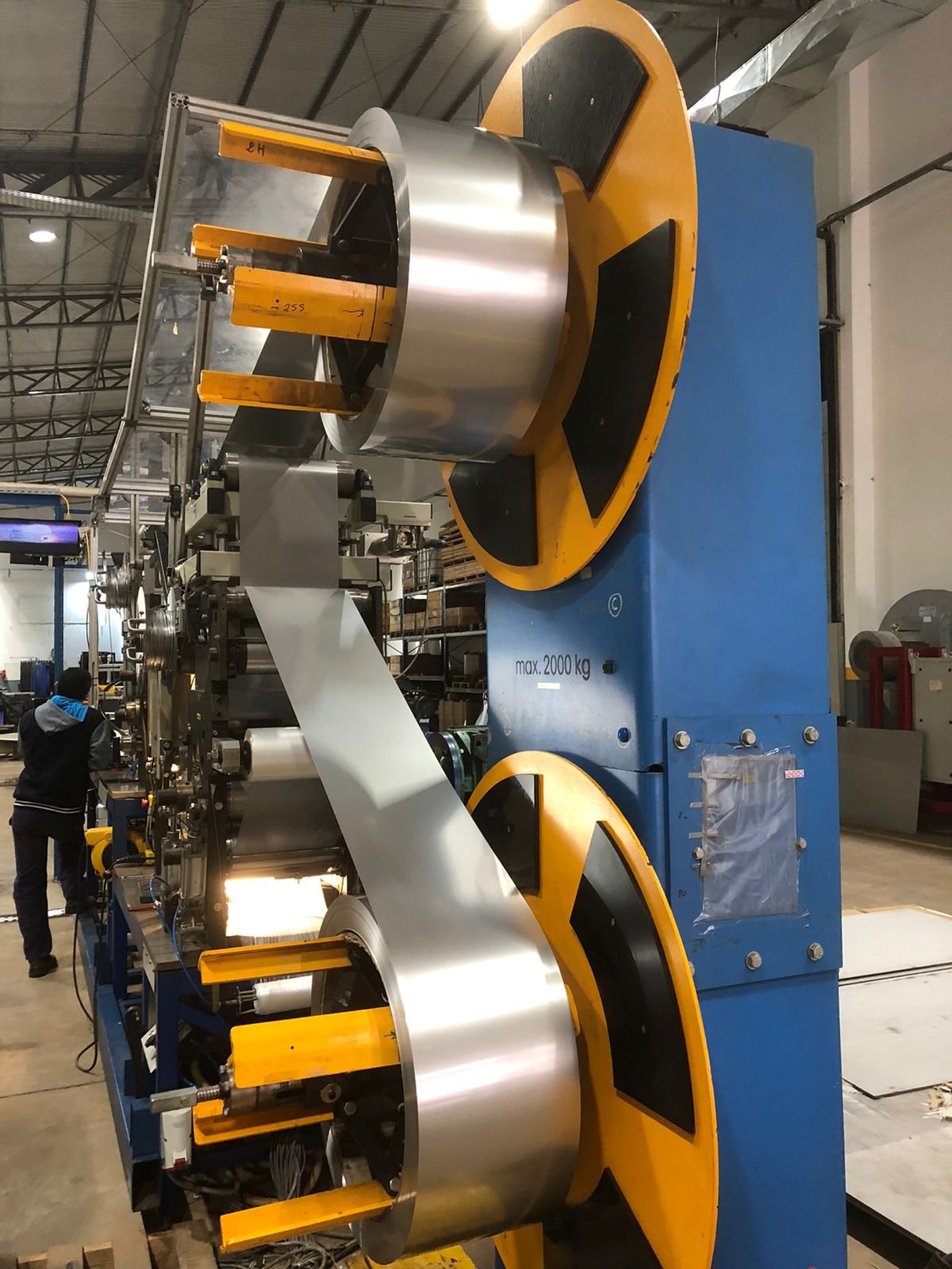 Two metal strip reels feeding the M1 doublet production line